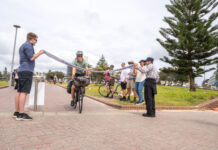 Nic Tremaine finishes his year-long 47,200 km ride at Bondi Beach